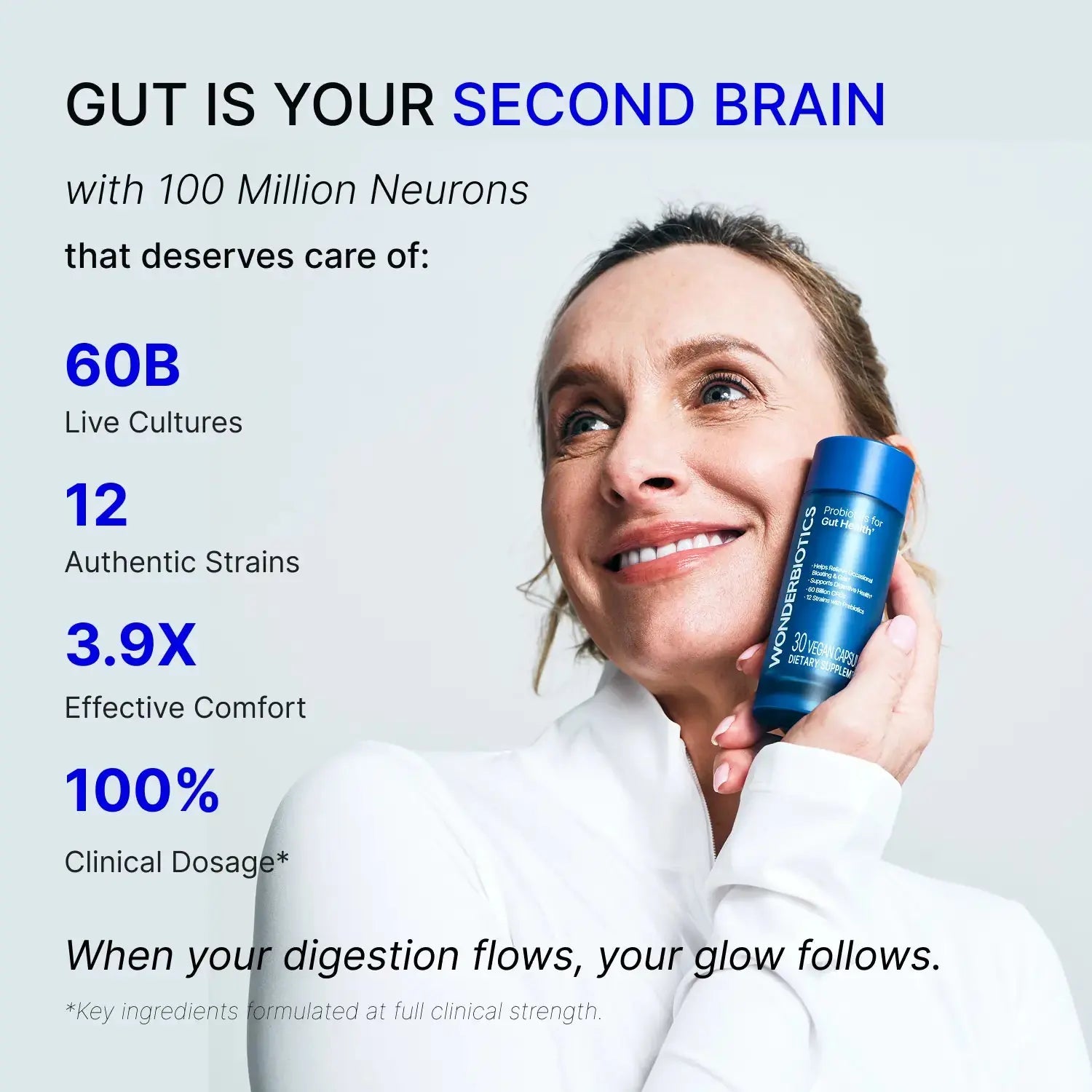 Probiotics for gut health: Woman holding supplement bottle. Healthy digestion support.